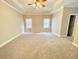 Large main bedroom with natural light and tray ceiling at 512 Clearwater Dr, Mcdonough, GA 30252