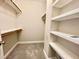 A walk-in closet with shelves and hanging space offers plenty of storage at 512 Clearwater Dr, Mcdonough, GA 30252