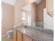 Modern bathroom features granite countertops, ample cabinet space, and a relaxing atmosphere at 6422 Phillips Ct, Lithonia, GA 30058