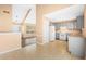 Open kitchen layout with tile floors and stainless steel appliances. Lots of natural light at 6422 Phillips Ct, Lithonia, GA 30058