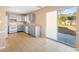 Bright kitchen boasts modern appliances, ample counter space, and a sliding door to the patio at 6422 Phillips Ct, Lithonia, GA 30058