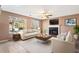 Inviting living room with a cozy fireplace, comfortable seating, and plenty of natural light at 6422 Phillips Ct, Lithonia, GA 30058