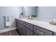Bathroom features a modern vanity with gray cabinets and a marble countertop at 6851 Roswell Rd # A-12, Atlanta, GA 30328