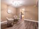 Bright dining area featuring a modern light fixture, neutral walls, and luxury vinyl plank flooring at 6851 Roswell Rd # A-12, Atlanta, GA 30328