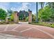 Community entrance sign with brickwork and landscaping leading to Abernathy Greenway at 6851 Roswell Rd # A-12, Atlanta, GA 30328