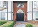 Close-up of a brick apartment building entrance with modern architectural details and landscaping at 6851 Roswell Rd # A-12, Atlanta, GA 30328