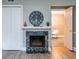 Living room with marble fireplace, mantle, and view of an adjacent room at 6851 Roswell Rd # A-12, Atlanta, GA 30328