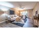 Bright living room featuring neutral walls, ceiling fan, stylish decor, and luxury vinyl plank flooring at 6851 Roswell Rd # A-12, Atlanta, GA 30328