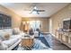 Inviting living room featuring neutral walls, a ceiling fan, stylish decor and LVP flooring at 6851 Roswell Rd # A-12, Atlanta, GA 30328