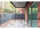 Outdoor patio with sliding glass doors and sturdy stone flooring at 6851 Roswell Rd # A-12, Atlanta, GA 30328