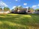 Spacious backyard with well-maintained lawn, mature trees, and a deck for outdoor relaxation and enjoyment at 2610 Betty Jean Dr, Jonesboro, GA 30236