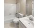 This white bathroom includes a shower-tub combo, sink, and toilet at 2610 Betty Jean Dr, Jonesboro, GA 30236