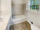 Bright bathroom featuring a tub-shower combo and modern vanity at 2610 Betty Jean Dr, Jonesboro, GA 30236