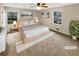 Staged bedroom with cozy decor, neutral color palette, and natural light at 2610 Betty Jean Dr, Jonesboro, GA 30236