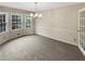 Bright dining room with elegant lighting and ample natural light at 2610 Betty Jean Dr, Jonesboro, GA 30236