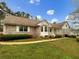 Beautiful brick home featuring manicured lawn and mature landscaping at 2610 Betty Jean Dr, Jonesboro, GA 30236