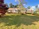 Manicured lawn and established landscaping enhance curb appeal at 2610 Betty Jean Dr, Jonesboro, GA 30236