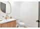 Bathroom featuring a modern vanity, gold faucet, and a toilet in a brightly lit space at 1598 Athens Ave, Atlanta, GA 30310