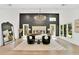 Primary bedroom suite showcases a modern chandelier, statement wall, and large windows at 1598 Athens Ave, Atlanta, GA 30310