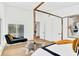 Modern bedroom with wood floors, large windows, stylish furnishings, and views to the rear yard at 1598 Athens Ave, Atlanta, GA 30310