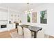 Contemporary dining room with stylish lighting, built-in bar, and neutral decor at 1598 Athens Ave, Atlanta, GA 30310