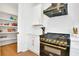 Gourmet kitchen with black appliances and a pantry for extra storage and organization at 1598 Athens Ave, Atlanta, GA 30310