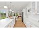 Open kitchen boasts expansive island, quartz countertops, and seamless flow to living spaces at 1598 Athens Ave, Atlanta, GA 30310