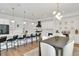 Bright kitchen featuring an island with seating, a modern dining table, and state-of-the-art appliances at 1598 Athens Ave, Atlanta, GA 30310
