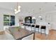 Spacious open-concept featuring kitchen, dining, and living areas with access to the outdoors at 1598 Athens Ave, Atlanta, GA 30310