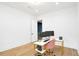 Bright office space features hardwood floors, a modern desk setup, and a stylish pink chair at 1598 Athens Ave, Atlanta, GA 30310