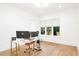Bright home office features hardwood floors, large window and a stylish desk with computer setup at 1598 Athens Ave, Atlanta, GA 30310