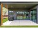 Covered patio with modern siding and sliding glass doors overlooks the backyard at 1598 Athens Ave, Atlanta, GA 30310