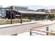 Exterior of the Chattahoochee Food Works with a modern industrial design and outdoor seating at 2721 Creek View Nw Ter, Atlanta, GA 30318