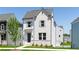 Charming two-story home featuring a painted brick facade, symmetrical windows, and a welcoming front entrance and manicured lawn at 2721 Creek View Nw Ter, Atlanta, GA 30318