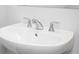 Close up of a white, ceramic sink with chrome faucet at 2721 Creek View Nw Ter, Atlanta, GA 30318