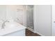 Modern bathroom with a dual sink vanity, glass shower, and stylish fixtures at 2725 Creek View Nw Ter, Atlanta, GA 30318