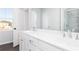 Luxurious bathroom featuring a dual sink vanity and a glass-enclosed shower with elegant tile work at 2725 Creek View Nw Ter, Atlanta, GA 30318