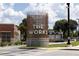 Modern sculptural monument sign reading 