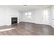 Comfortable living room with fireplace, and door leading to the backyard, offering a perfect blend of indoor-outdoor living at 2725 Creek View Nw Ter, Atlanta, GA 30318