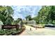 Entrance to Westside Park in Atlanta, featuring a modern sculpture, lush greenery, and walking paths at 2725 Creek View Nw Ter, Atlanta, GA 30318