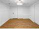 Finished basement with wooden floors, a white door, and recessed lights at 3248 Holly Mill Run, Marietta, GA 30062