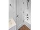 Clean bathroom features new fixtures, a white door, and a shower with white tile at 3248 Holly Mill Run, Marietta, GA 30062