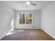 Neutral bedroom with large window for natural light and ceiling fan at 3248 Holly Mill Run, Marietta, GA 30062