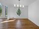 Elegant dining room with unique diamond window and hardwood floors at 3248 Holly Mill Run, Marietta, GA 30062