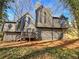 Modern two-story home with unique architectural features and professionally landscaped front yard at 3248 Holly Mill Run, Marietta, GA 30062