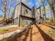 Contemporary home with a driveway leading to an attached garage at 3248 Holly Mill Run, Marietta, GA 30062