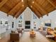 Open concept living room with vaulted wood ceilings, stone fireplace, and ample natural light at 3248 Holly Mill Run, Marietta, GA 30062