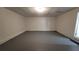 Clean basement with painted floor, ready for customization and with access to utility door at 336 Sir Richard Ct, Jonesboro, GA 30236