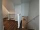 Basement entrance via staircase with hardwood floors leading to finished basement at 336 Sir Richard Ct, Jonesboro, GA 30236