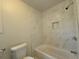 Clean bathroom with a tub/shower combo, tiled walls, and modern fixtures, perfect for relaxation at 336 Sir Richard Ct, Jonesboro, GA 30236
